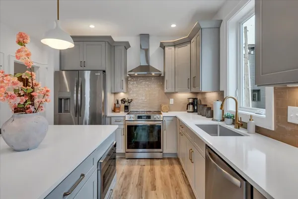 a living room with fireplace furniture and a flat screen tv