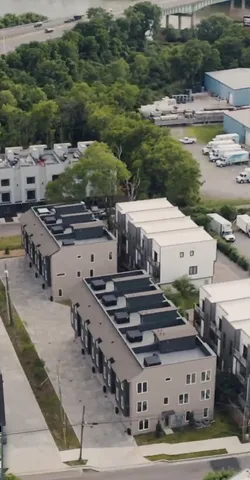 a view of a backyard with plants and lake view