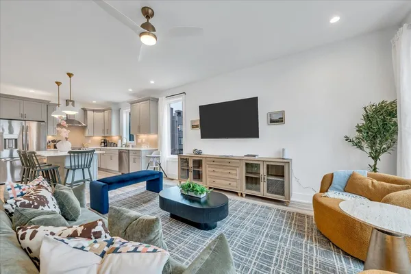 a spacious bathroom with a tub shower and mirror