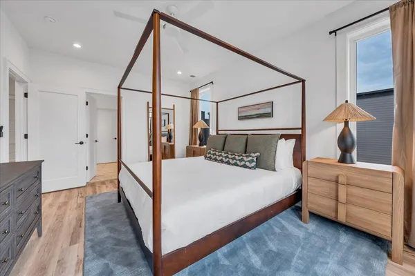 a view of roof deck with table and chairs