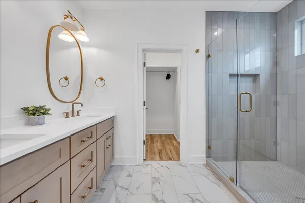 an outdoor sitting area with furniture and city view