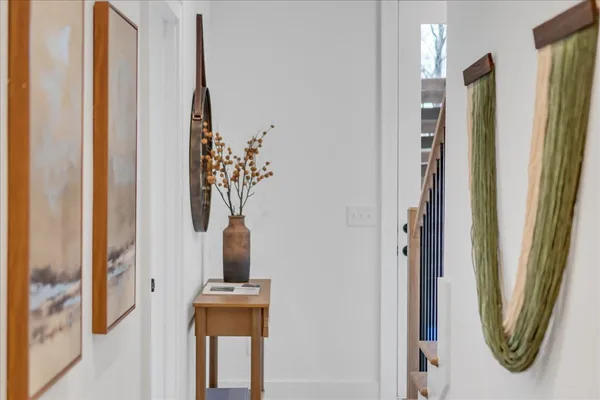 a view of entryway with wooden floor and a rug
