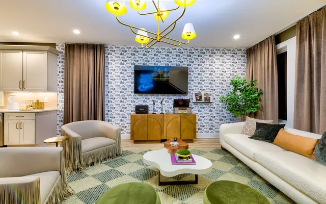 a living room with furniture and a flat screen tv