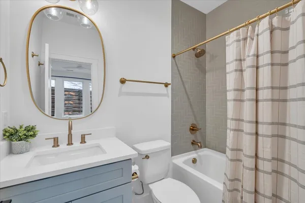 a kitchen with stainless steel appliances granite countertop a kitchen island a stove a table and chairs