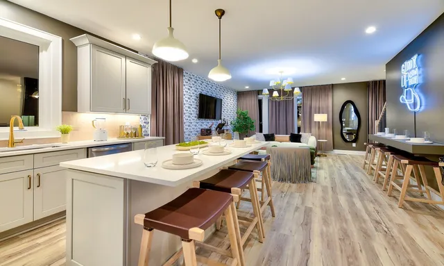 a large kitchen with a table and chairs