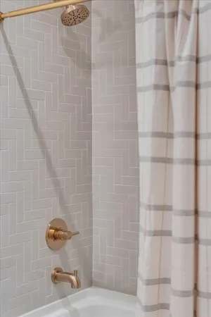 a kitchen with stainless steel appliances kitchen island granite countertop a dining table chairs sink and cabinets