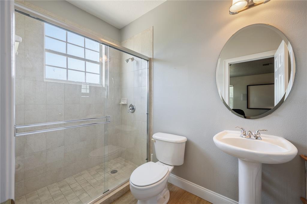 2002 Water Key Drive Windermere, FL 34786 - Photo 27 of 60 a bathroom with a sink toilet and a mirror