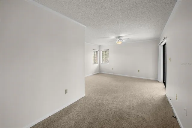 a view of a livingroom with a ceiling fan