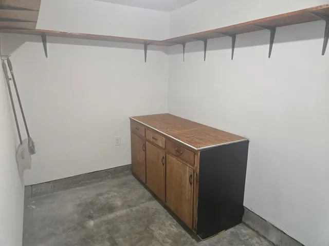 a utility room with cabinets