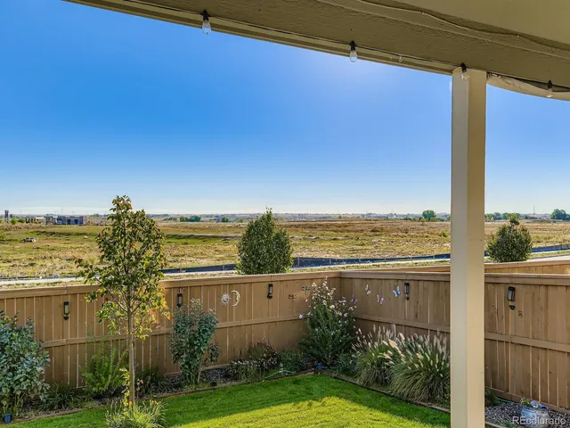 a view of a large building with a yard