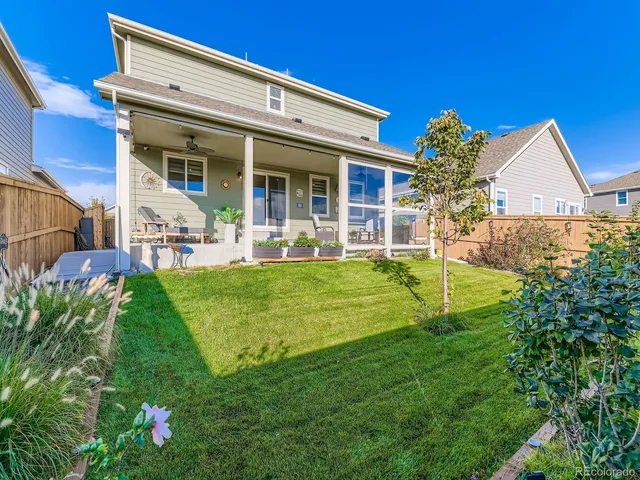 a front view of a house with garden and porch