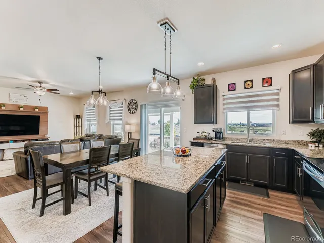 a kitchen with sink and center island