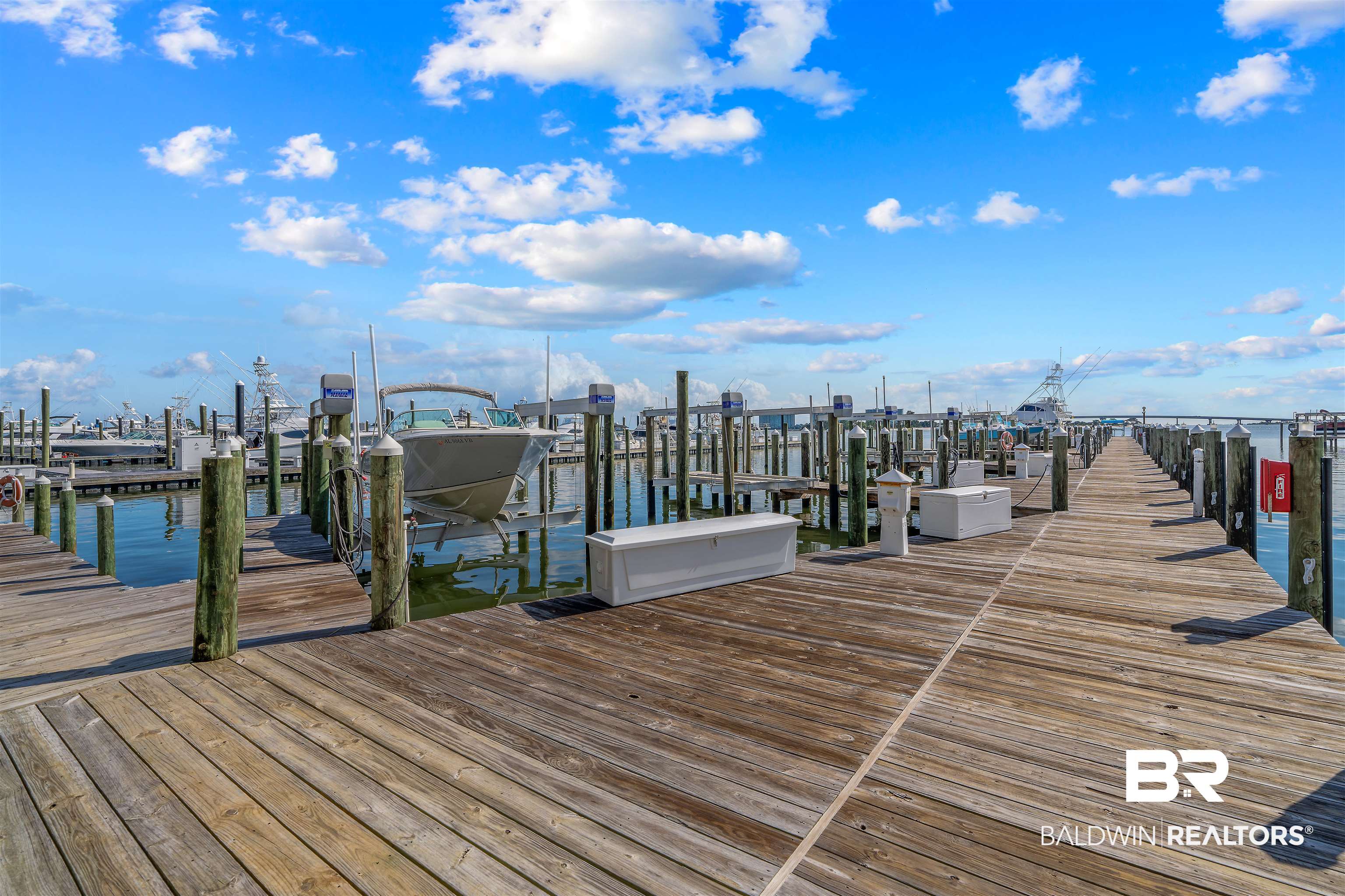 27800 Canal Road, Unit 113 Orange Beach, AL 36561 - Photo 27 of 35 Dock featuring boat lift and a water view