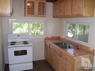 1084 Alta Vista Road Simi Valley, CA 93063 - Photo 3 of 9 a kitchen with a stove and a sink