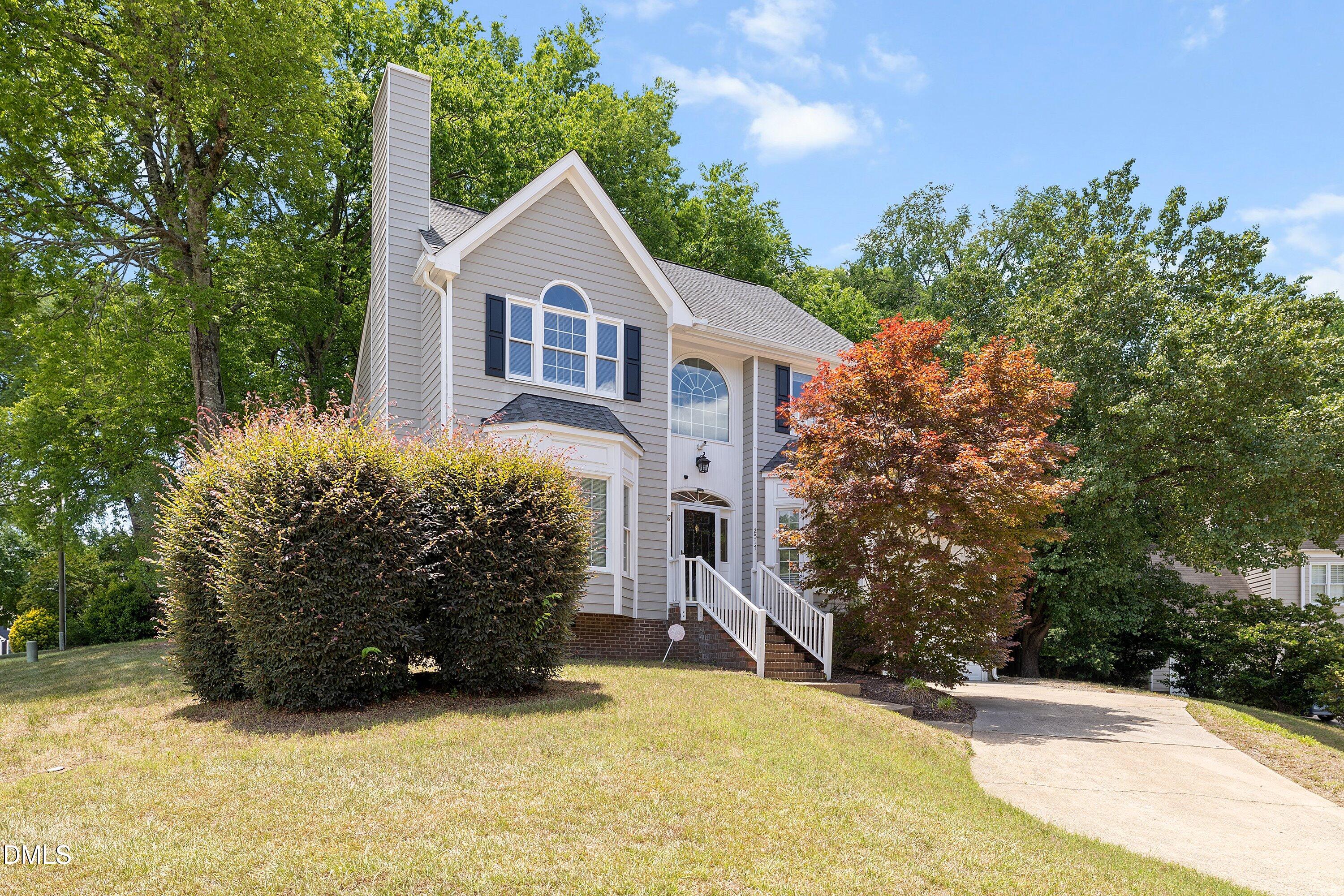2517 Birchford Court Raleigh, NC 27604 - Photo 4 of 63 a view of a house with a yard and large trees