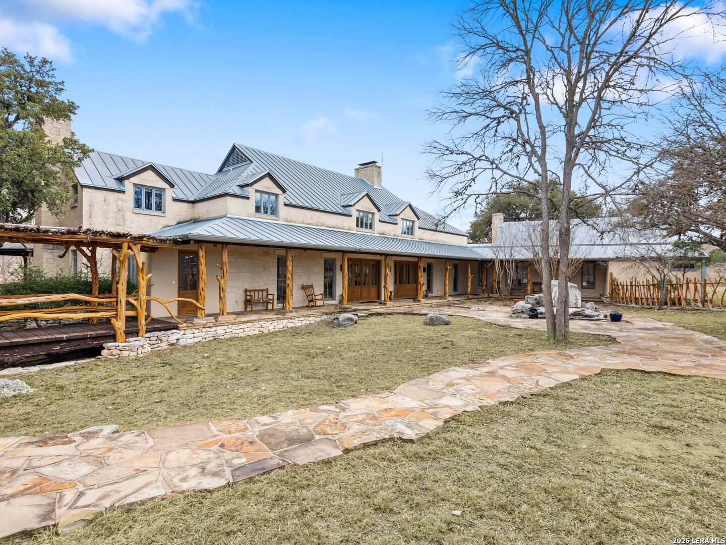 730 Eagle Ridge Road Center Point, TX 78010 - Photo 13 of 50 a front view of a house with swimming pool and a yard