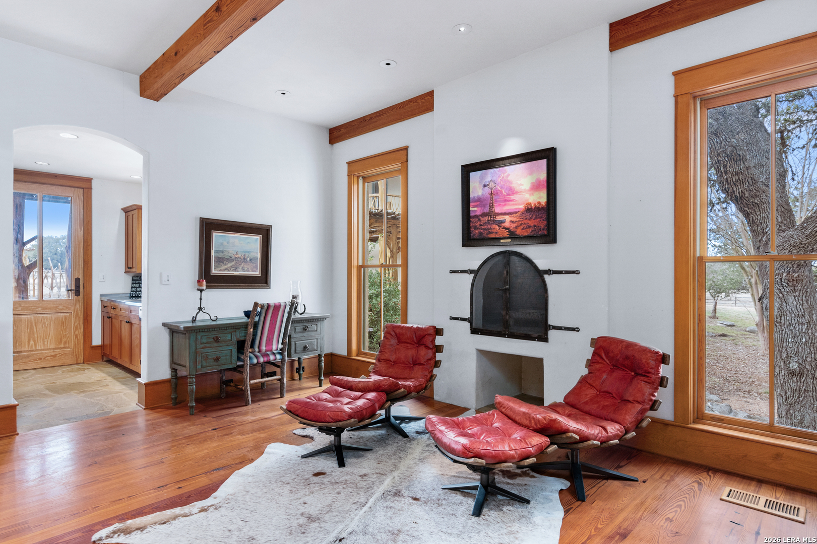 730 Eagle Ridge Road Center Point, TX 78010 - Photo 23 of 50 a living room with furniture a wooden floor and a large window