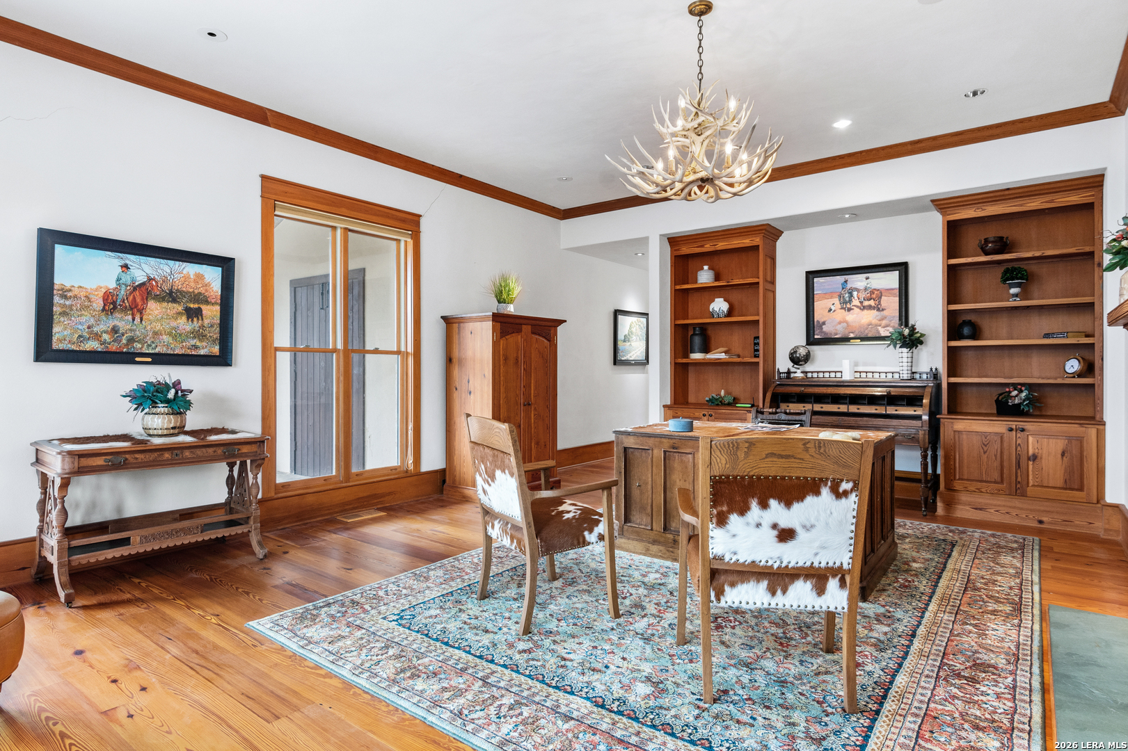 730 Eagle Ridge Road Center Point, TX 78010 - Photo 26 of 50 a living room with furniture and a chandelier