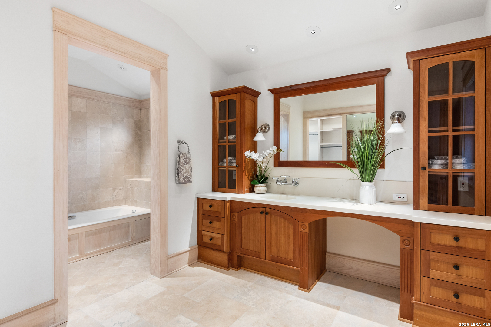 730 Eagle Ridge Road Center Point, TX 78010 - Photo 29 of 50 a bathroom with a tub a sink and mirror