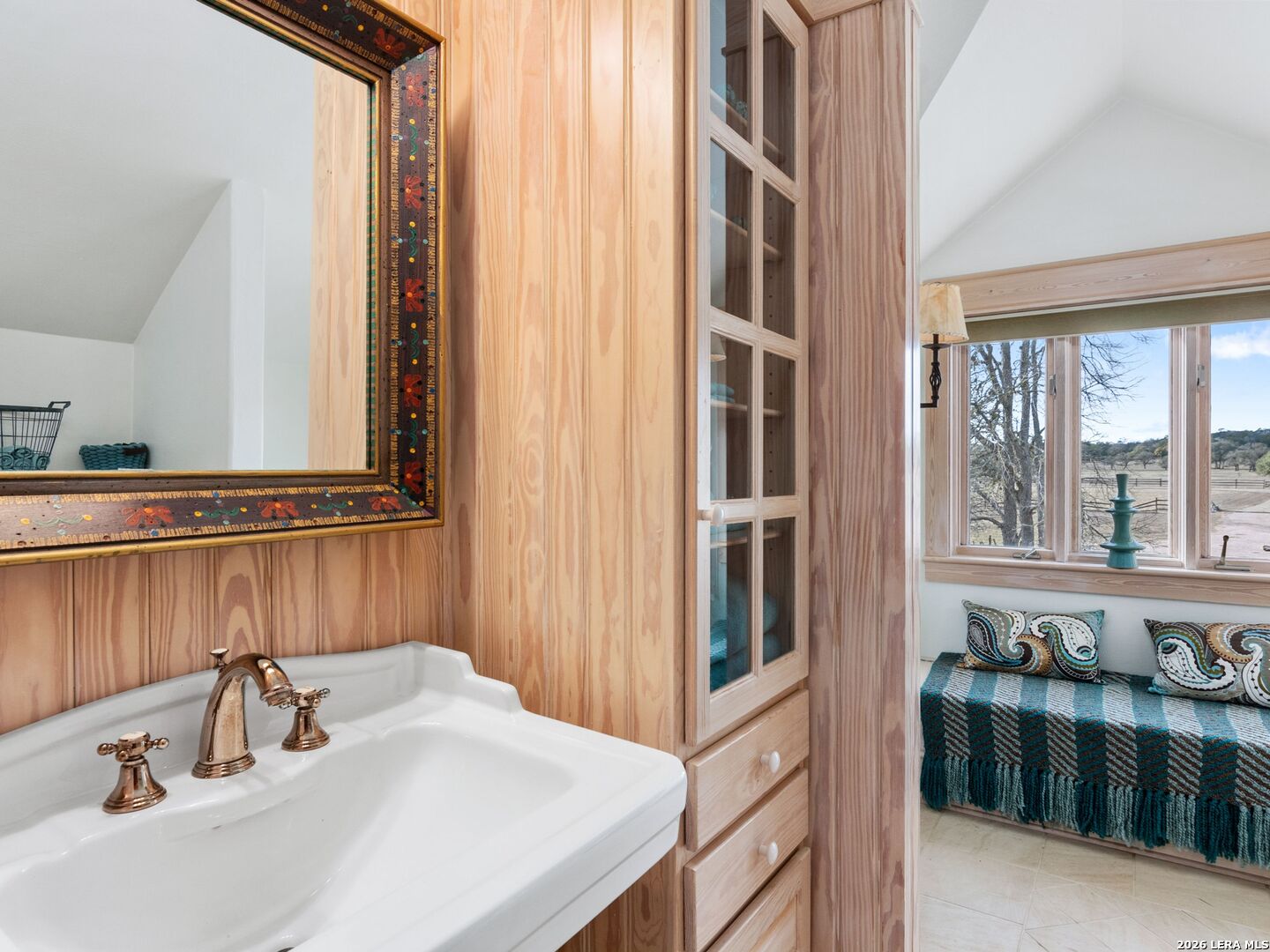 730 Eagle Ridge Road Center Point, TX 78010 - Photo 39 of 50 a bathroom with a sink and a mirror