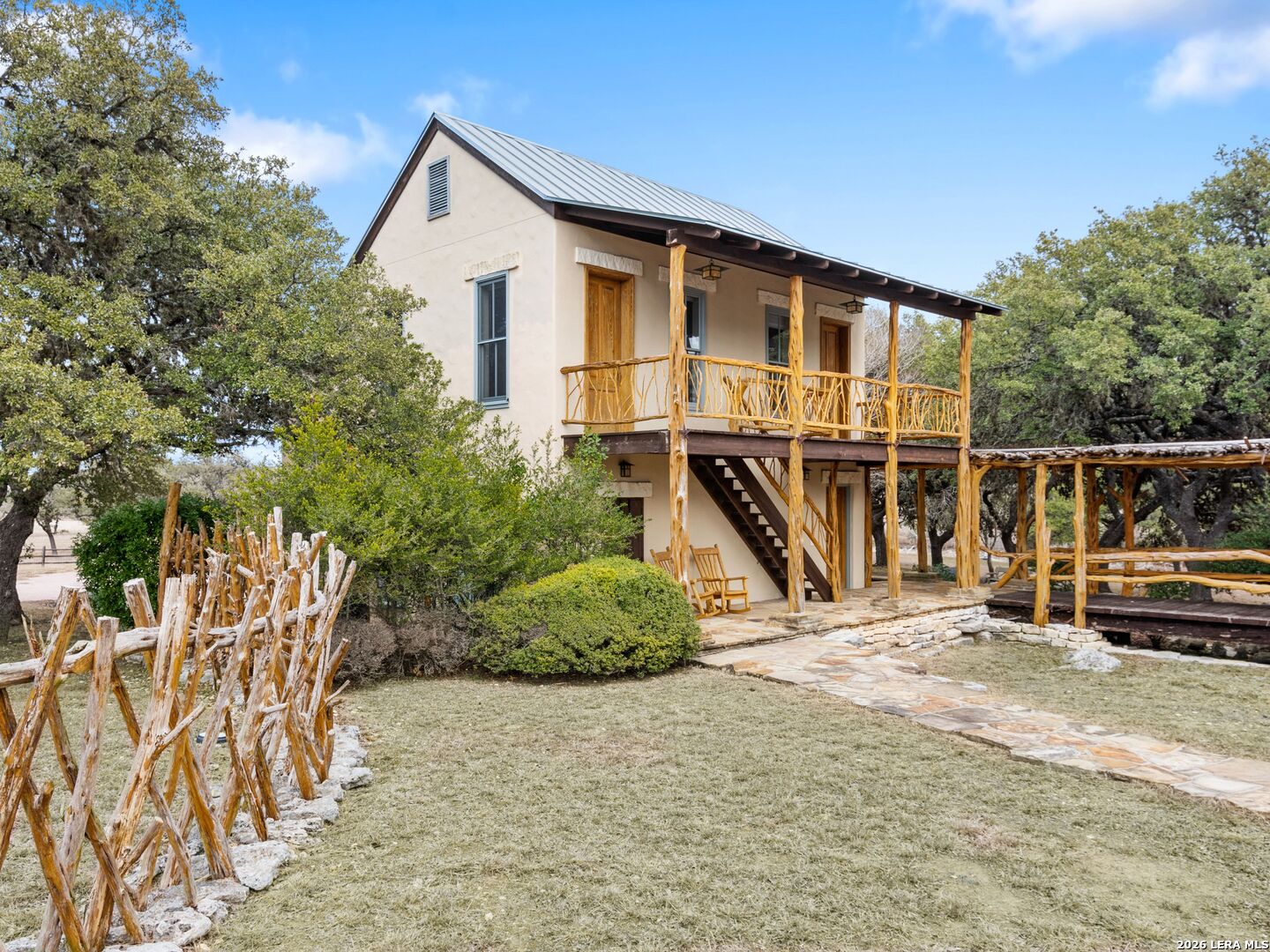 730 Eagle Ridge Road Center Point, TX 78010 - Photo 50 of 50 a view of a house with a yard and lawn chairs