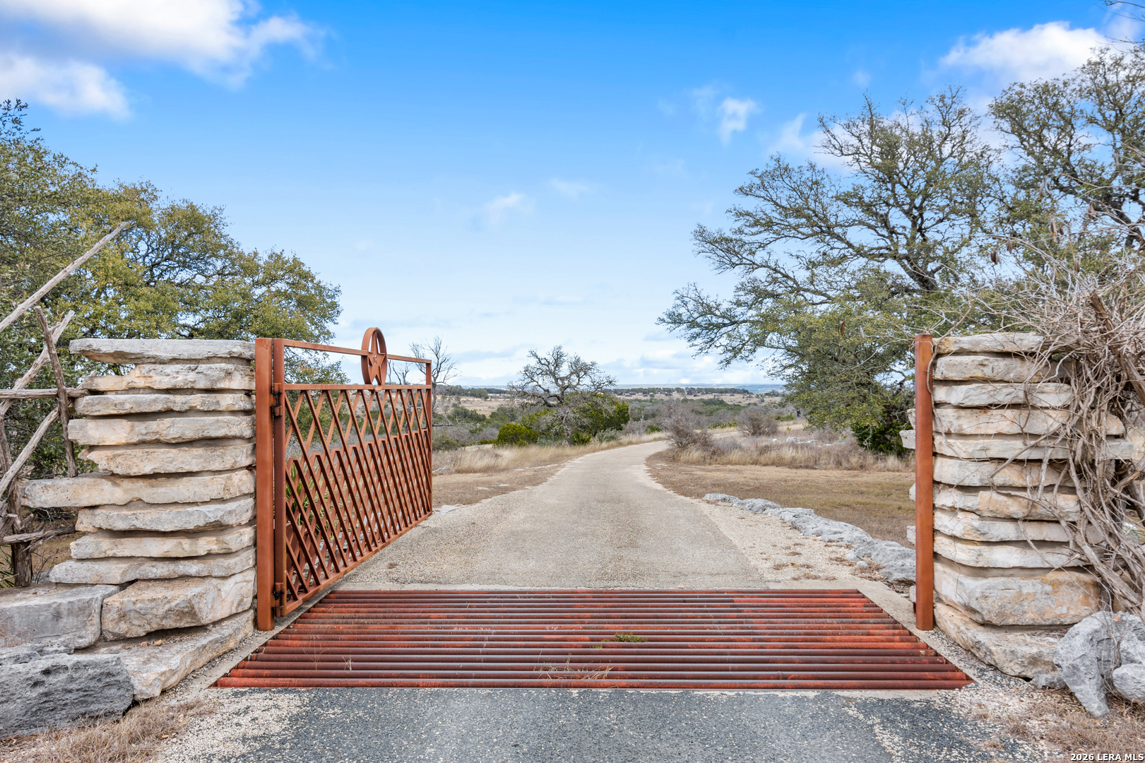 730 Eagle Ridge Road Center Point, TX 78010 - Photo 9 of 50 a view of a pathway with a wrought fence