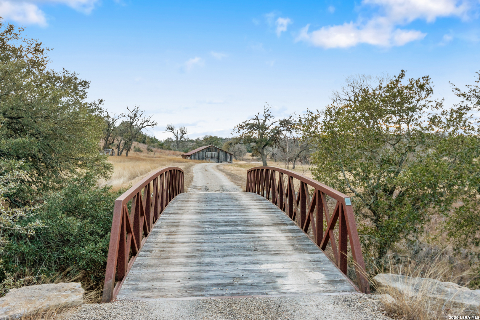 730 Eagle Ridge Road Center Point, TX 78010 - Photo 10 of 50 a view of a balcony with wooden floor and fence