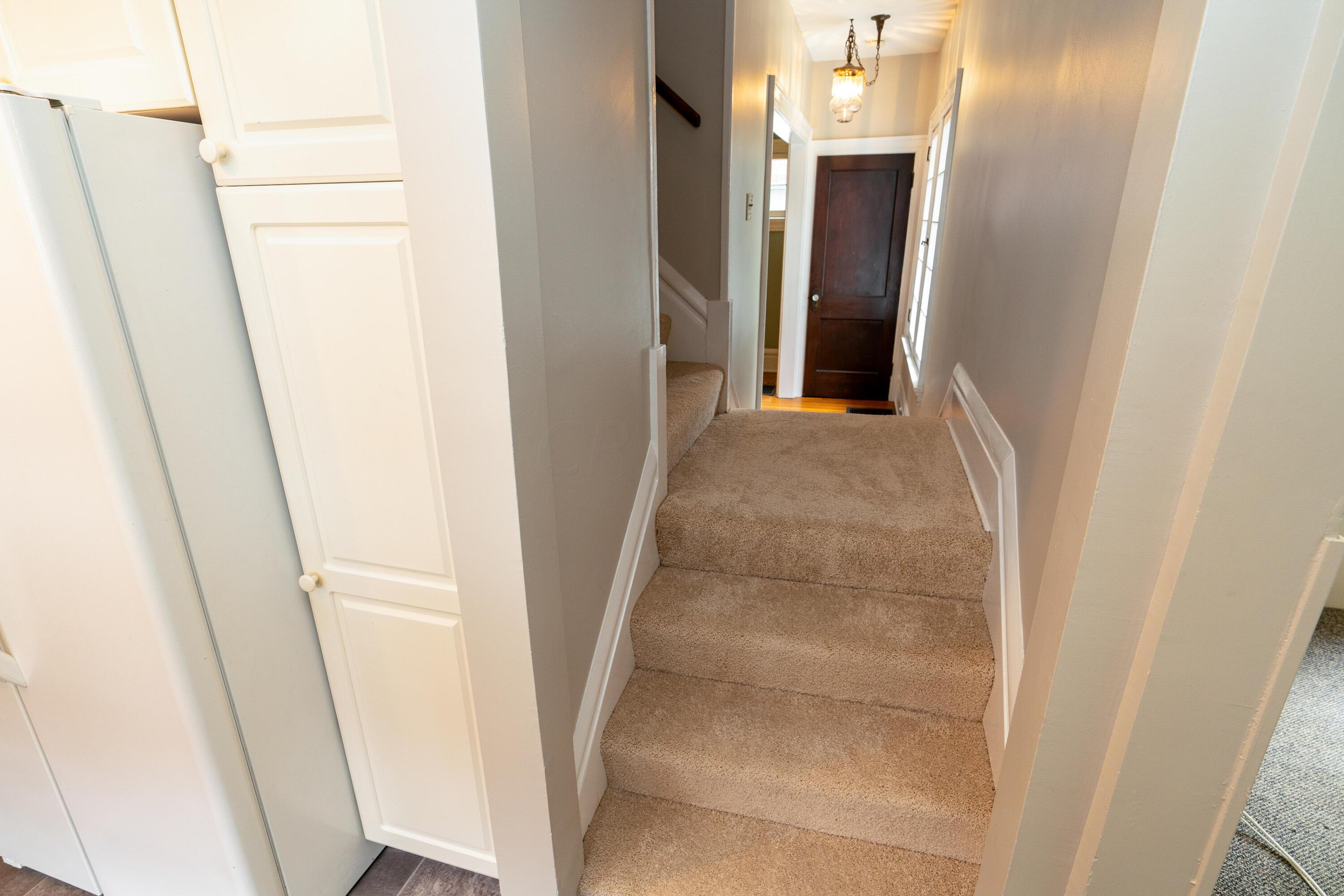54 East Tulane Road Columbus, OH 43202 - Photo 16 of 36 Split staircase offers easy access to both the living room and kitchen.