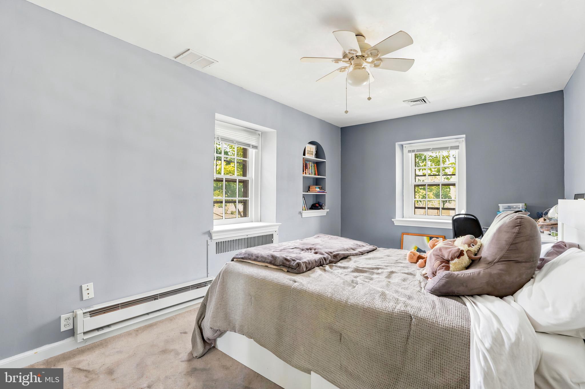 284 Trent Road Wynnewood, PA 19096 - Photo 14 of 31 a bedroom with a bed and a chandelier