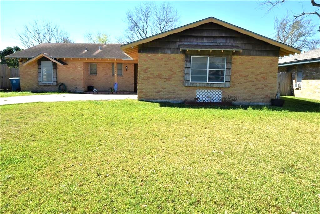 a front view of a house with yard
