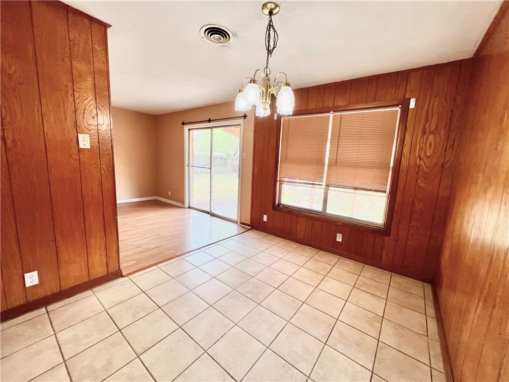 112 Rice Drive Portland, TX 78374 - Photo 9 of 30 a view of an empty room with window and chandelier fan