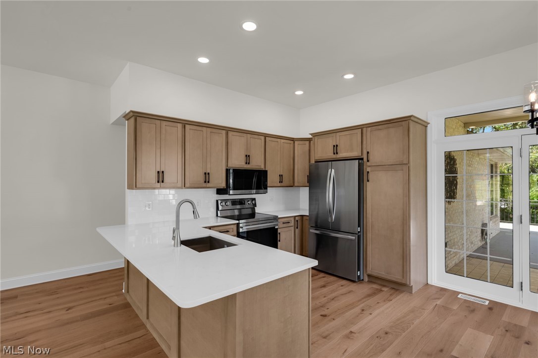 623 Bridgeview Avenue Chester, WV 26034 - Photo 7 of 47 Eat-in kitchen featuring stainless steel appliances and hardwood floors