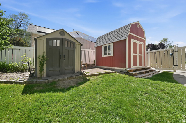 883 East 700 South Springville, UT 84663 - Photo 56 of 59 Expansive lawn area featuring two distinct storage sheds