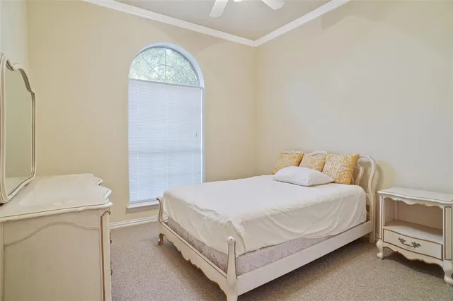 a bedroom with a bed and a table in it