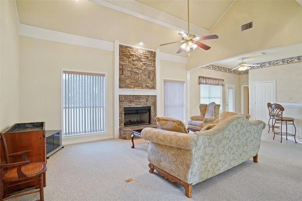 809 Amon Trail Azle, TX 76020 - Photo 2 of 22 a living room with furniture and a fireplace
