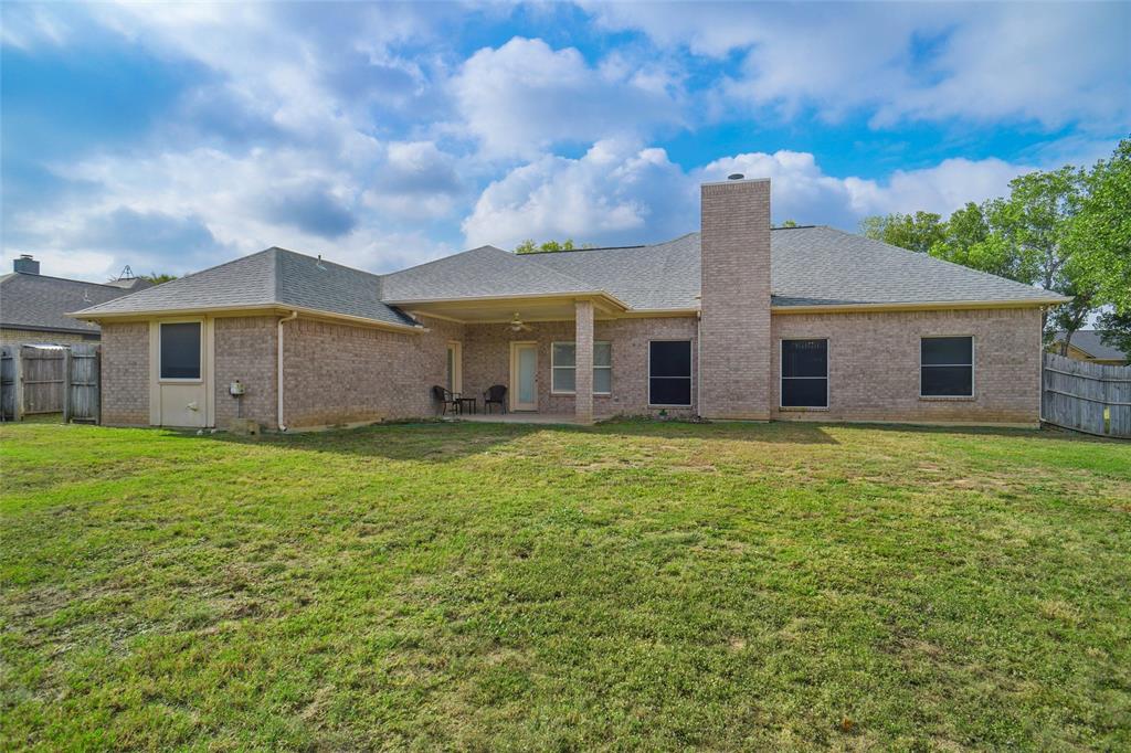 809 Amon Trail Azle, TX 76020 - Photo 22 of 22 a view of a house with a backyard