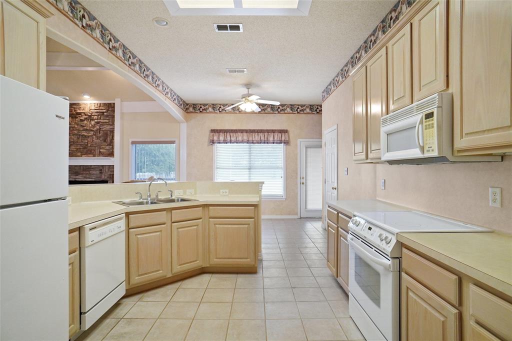 809 Amon Trail Azle, TX 76020 - Photo 9 of 22 a kitchen with a sink stove and cabinets