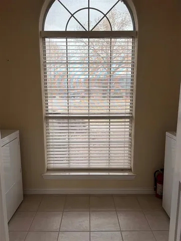 a view of a room that has a window in it