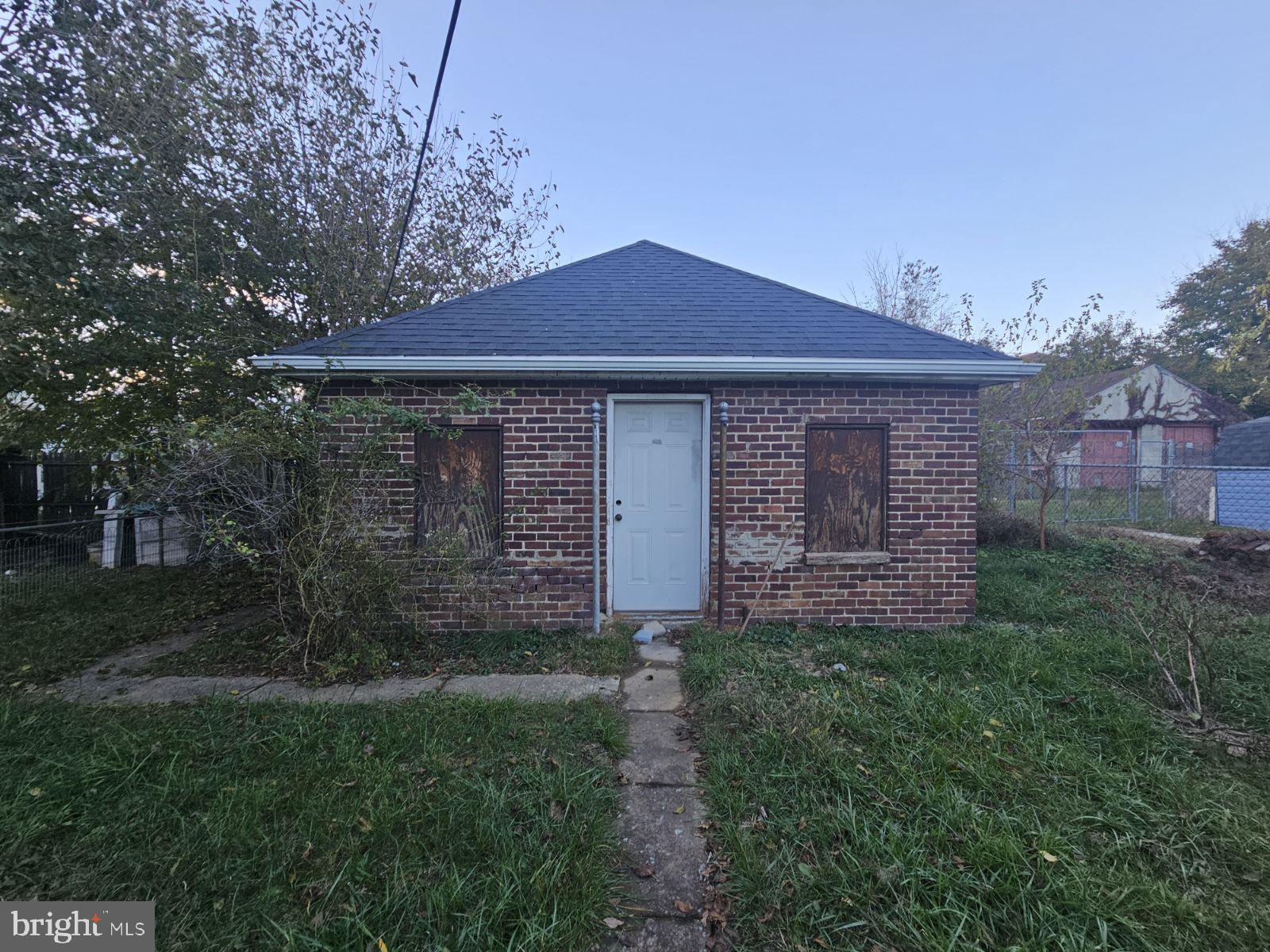 977 Edison Street York, PA 17403 - Photo 3 of 6 a front view of a house with a garden