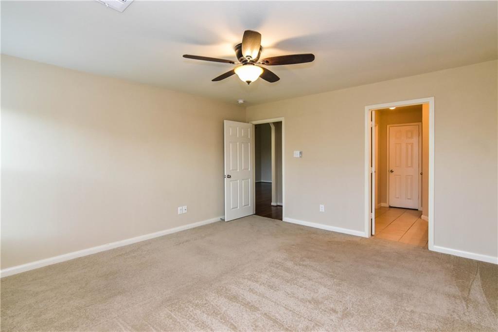 216 Mill Street Anna, TX 75409 - Photo 11 of 22 a view of an empty room and chandelier fan