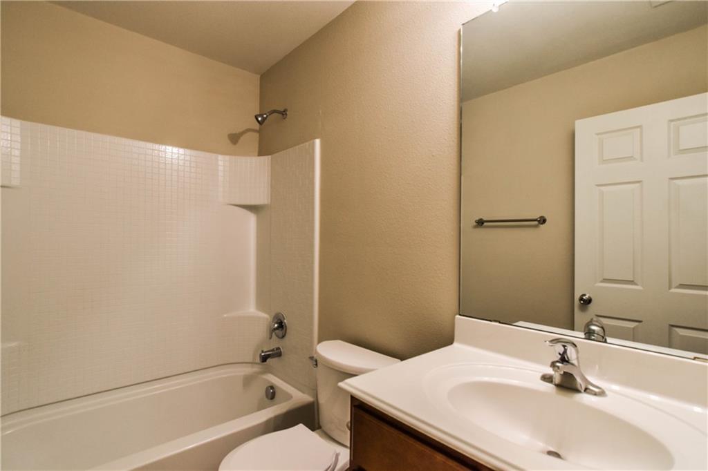 216 Mill Street Anna, TX 75409 - Photo 14 of 22 a bathroom with a sink toilet and shower