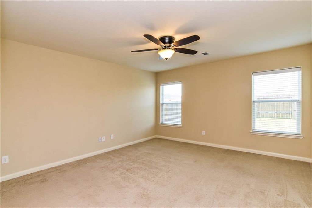 216 Mill Street Anna, TX 75409 - Photo 10 of 22 a view of an empty room with a window