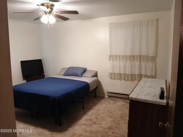 a bedroom with a bed and a table