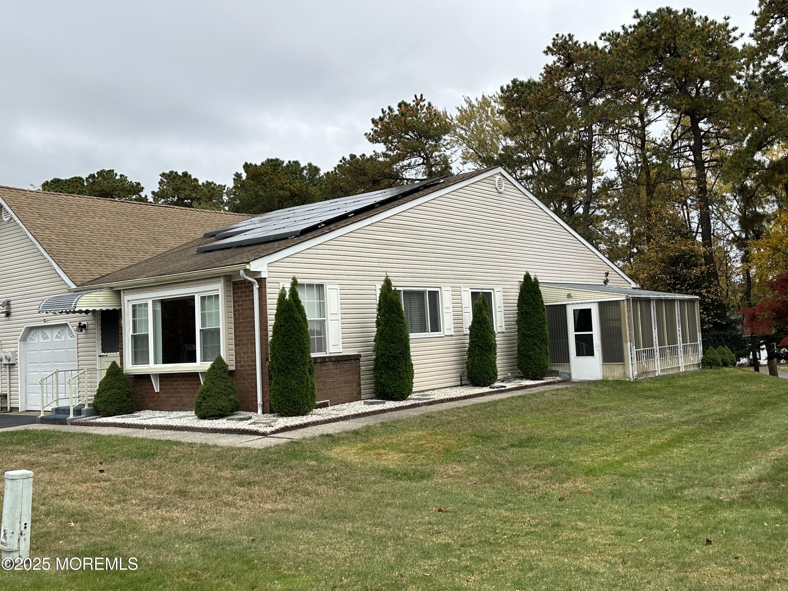 3 B Drake Street, Unit 53 Whiting, NJ 08759 - Photo 3 of 25 a view of a house with a yard and potted plants