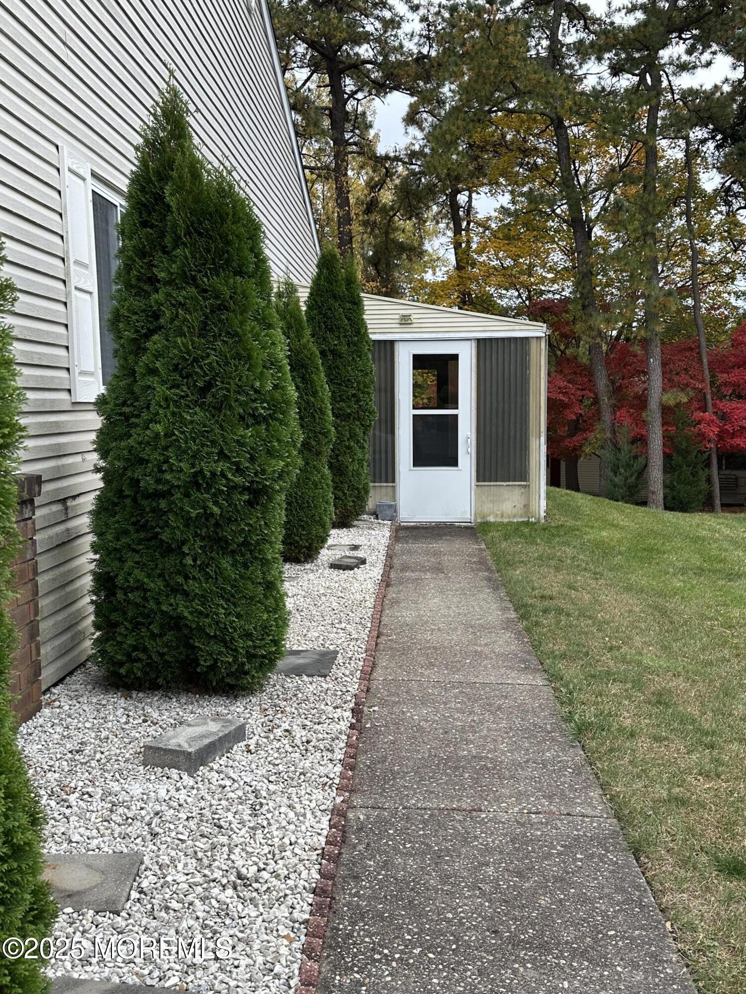 3 B Drake Street, Unit 53 Whiting, NJ 08759 - Photo 4 of 25 a front view of a house with garden