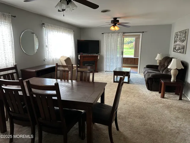 a view of a dining room with furniture