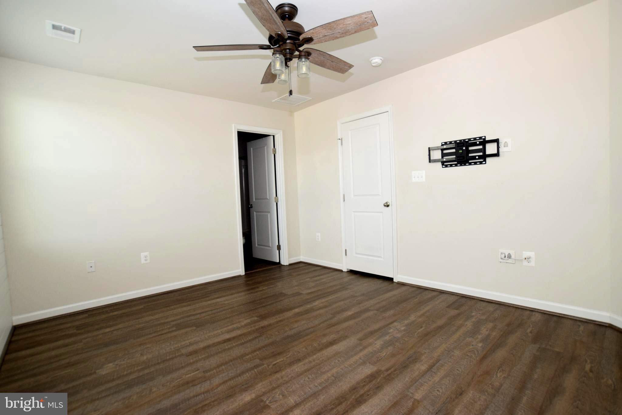 2840 Farzi Circle Locust Grove, VA 22508 - Photo 12 of 21 wooden floor in an empty room