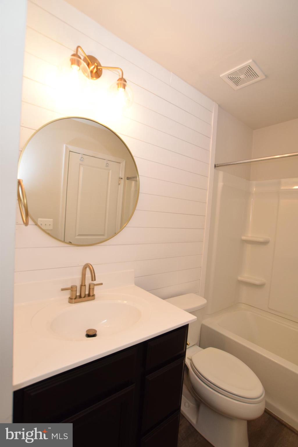 2840 Farzi Circle Locust Grove, VA 22508 - Photo 14 of 21 a bathroom with a sink a toilet and shower