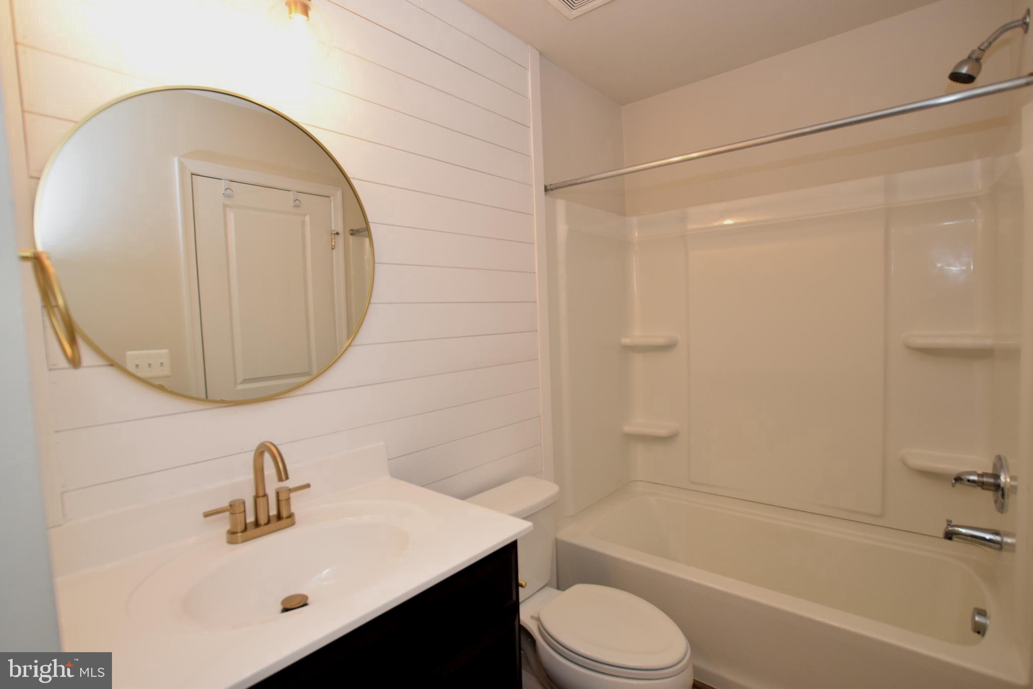 2840 Farzi Circle Locust Grove, VA 22508 - Photo 15 of 21 a bathroom with a sink a toilet and shower