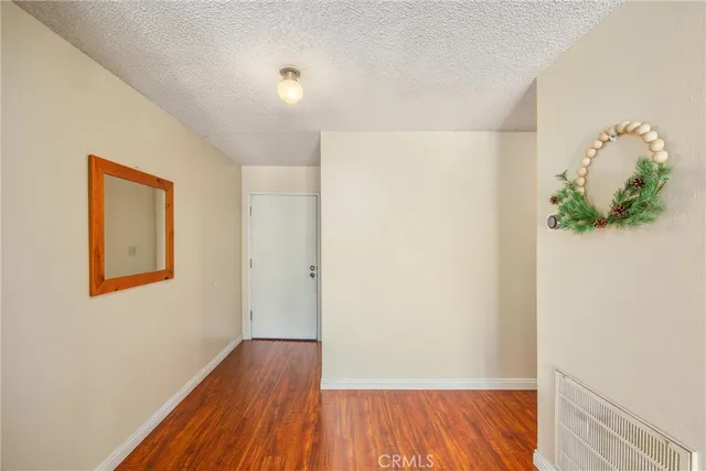 a view of hallway with wooden floor